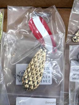 Strike King fishing lure, plus some spoons nearly 3" long and a weedless jig.