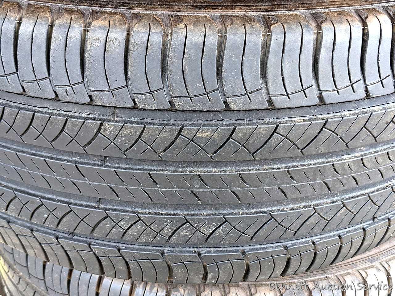 Set of 4 Michelin Latitude Tour HP tires are marked 255 / 55R18. Some weather checking noted in