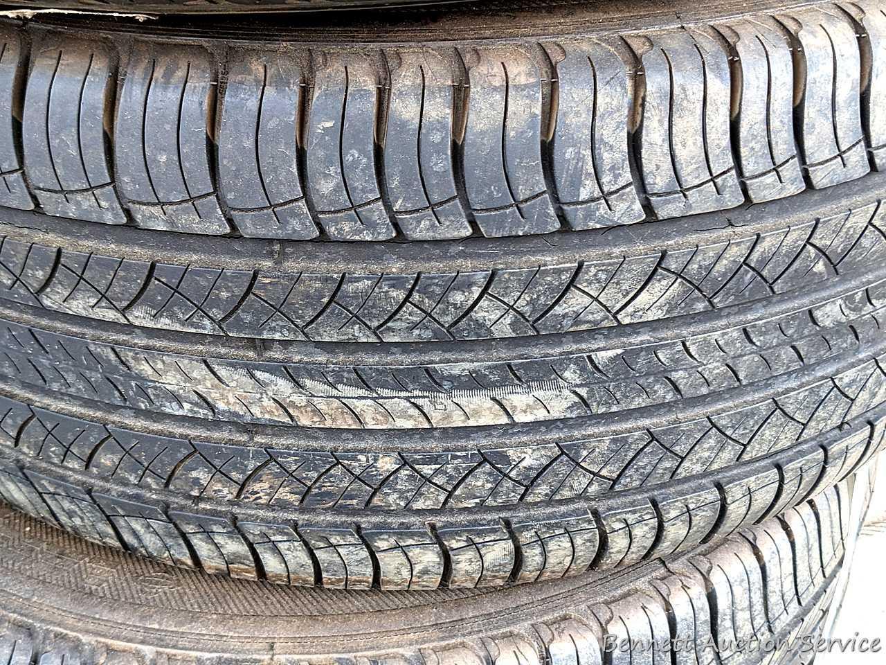 Set of 4 Michelin Latitude Tour HP tires are marked 255 / 55R18. Some weather checking noted in