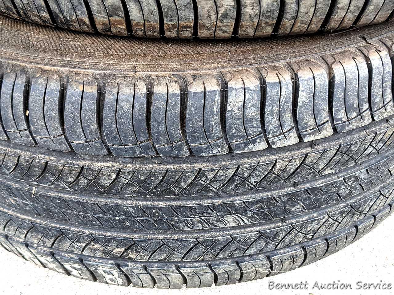 Set of 4 Michelin Latitude Tour HP tires are marked 255 / 55R18. Some weather checking noted in