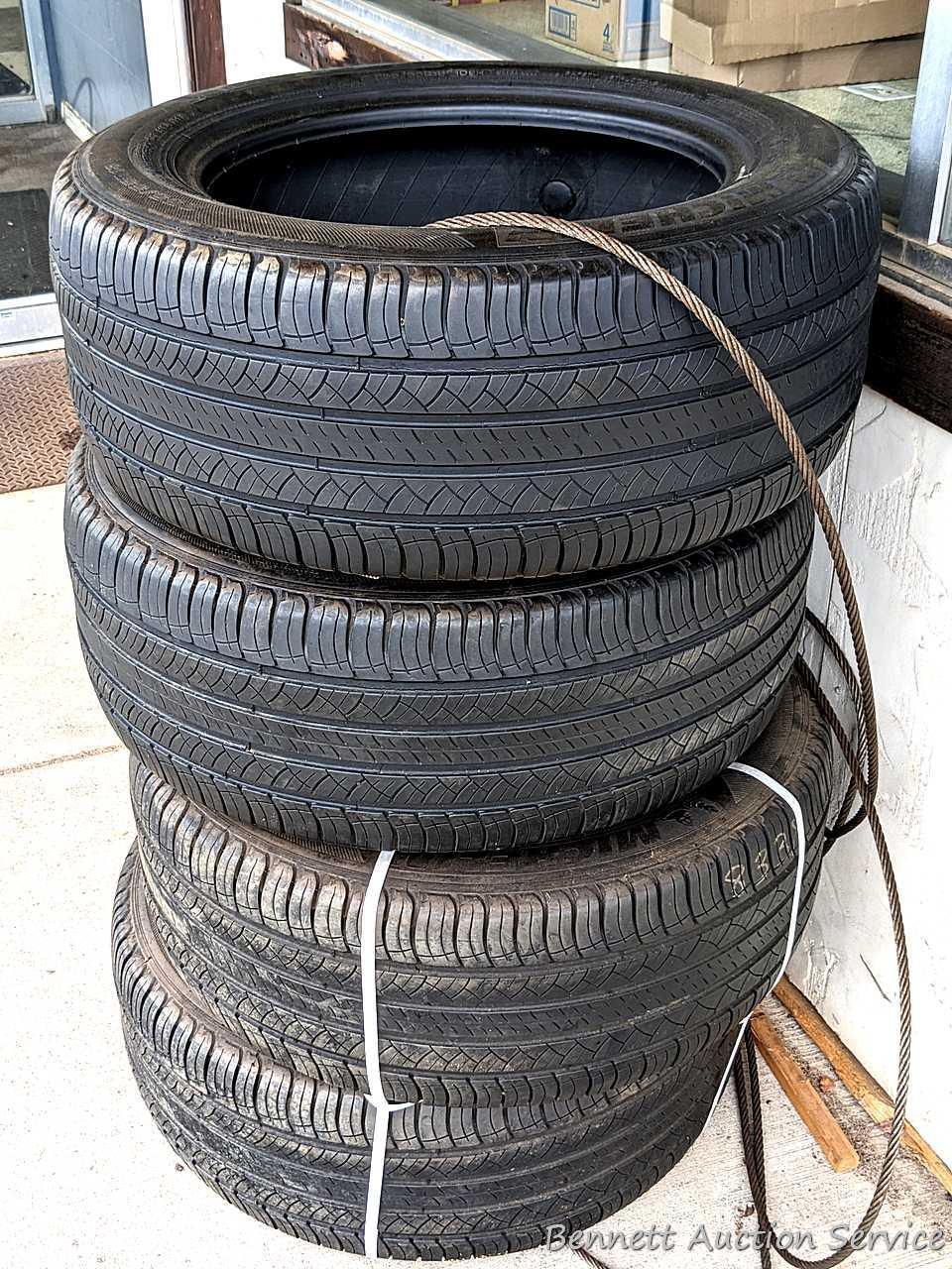 Set of 4 Michelin Latitude Tour HP tires are marked 255 / 55R18. Some weather checking noted in