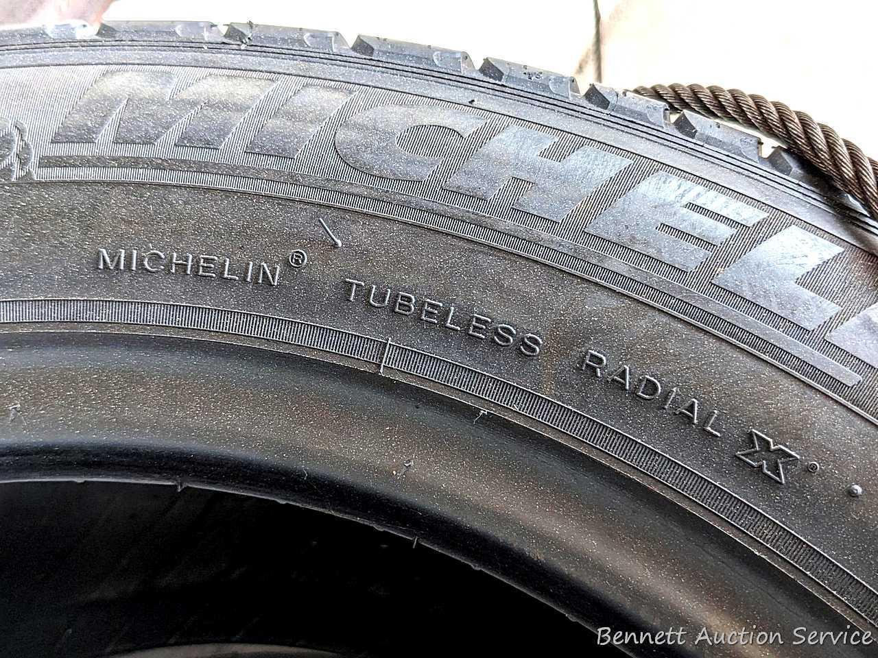 Set of 4 Michelin Latitude Tour HP tires are marked 255 / 55R18. Some weather checking noted in