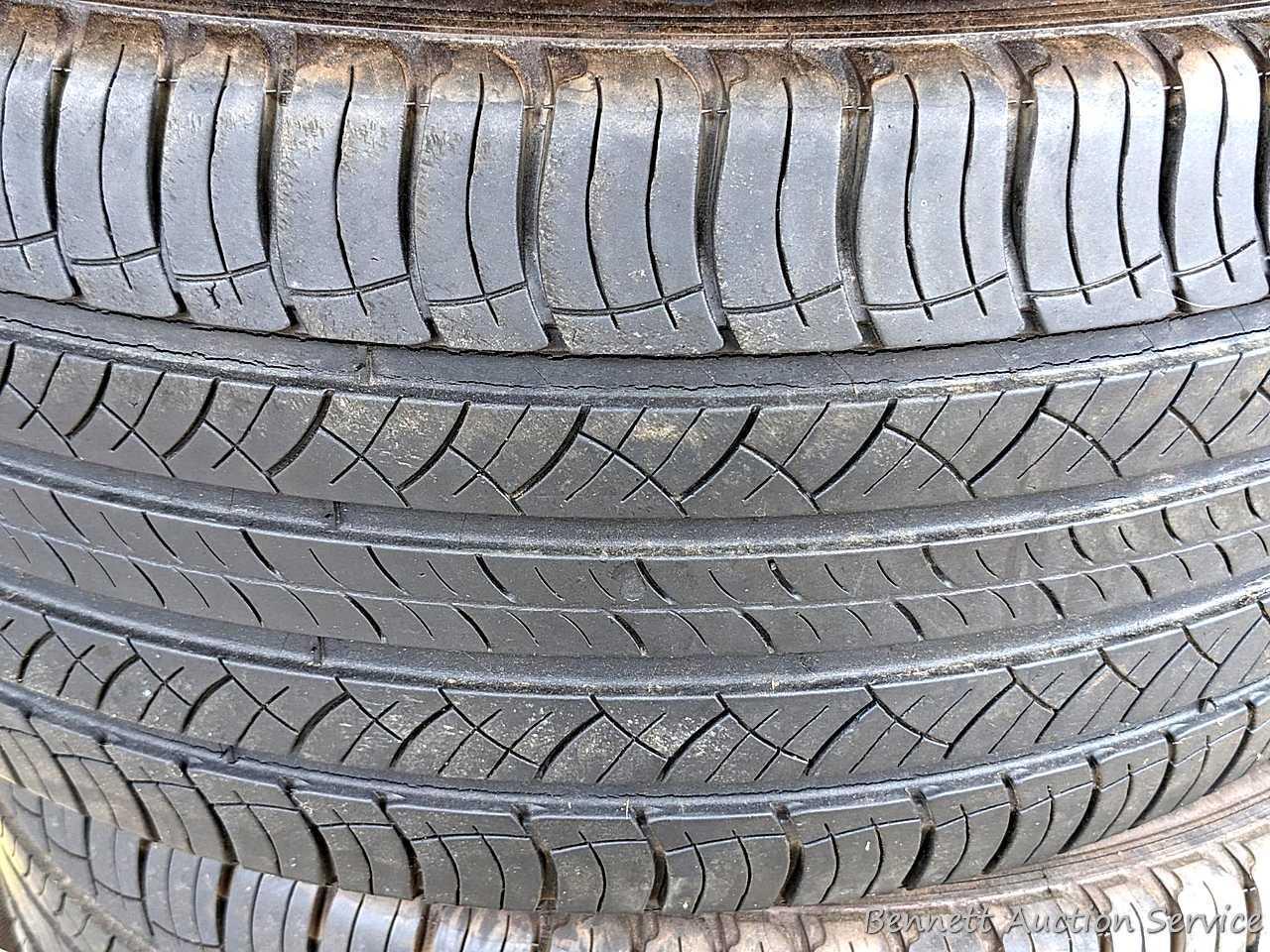 Set of 4 Michelin Latitude Tour HP tires are marked 255 / 55R18. Some weather checking noted in