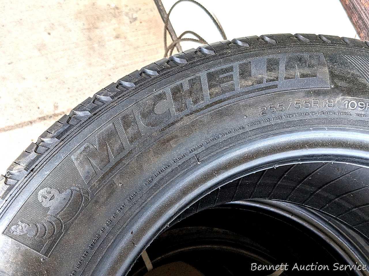 Set of 4 Michelin Latitude Tour HP tires are marked 255 / 55R18. Some weather checking noted in