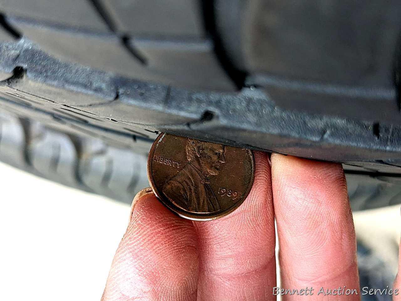Set of 4 Michelin Latitude Tour HP tires are marked 255 / 55R18. Some weather checking noted in