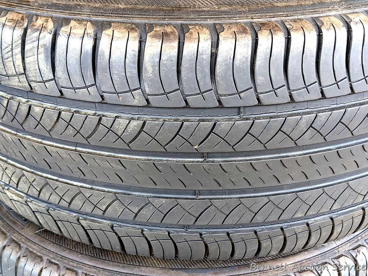 Set of 4 Michelin Latitude Tour HP tires are marked 255 / 55R18. Some weather checking noted in