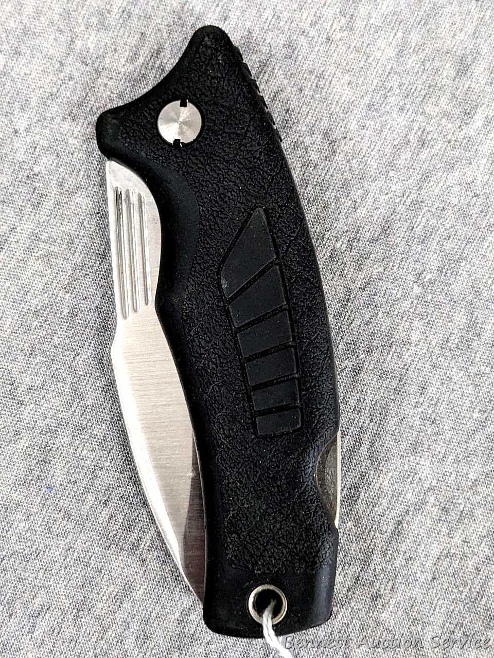 Schrade folding knife, SG8, measures 8-1/2" open. Blade and handle slabs are tight. Made in USA.