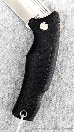 Schrade folding knife, SG8, measures 8-1/2" open. Blade and handle slabs are tight. Made in USA.