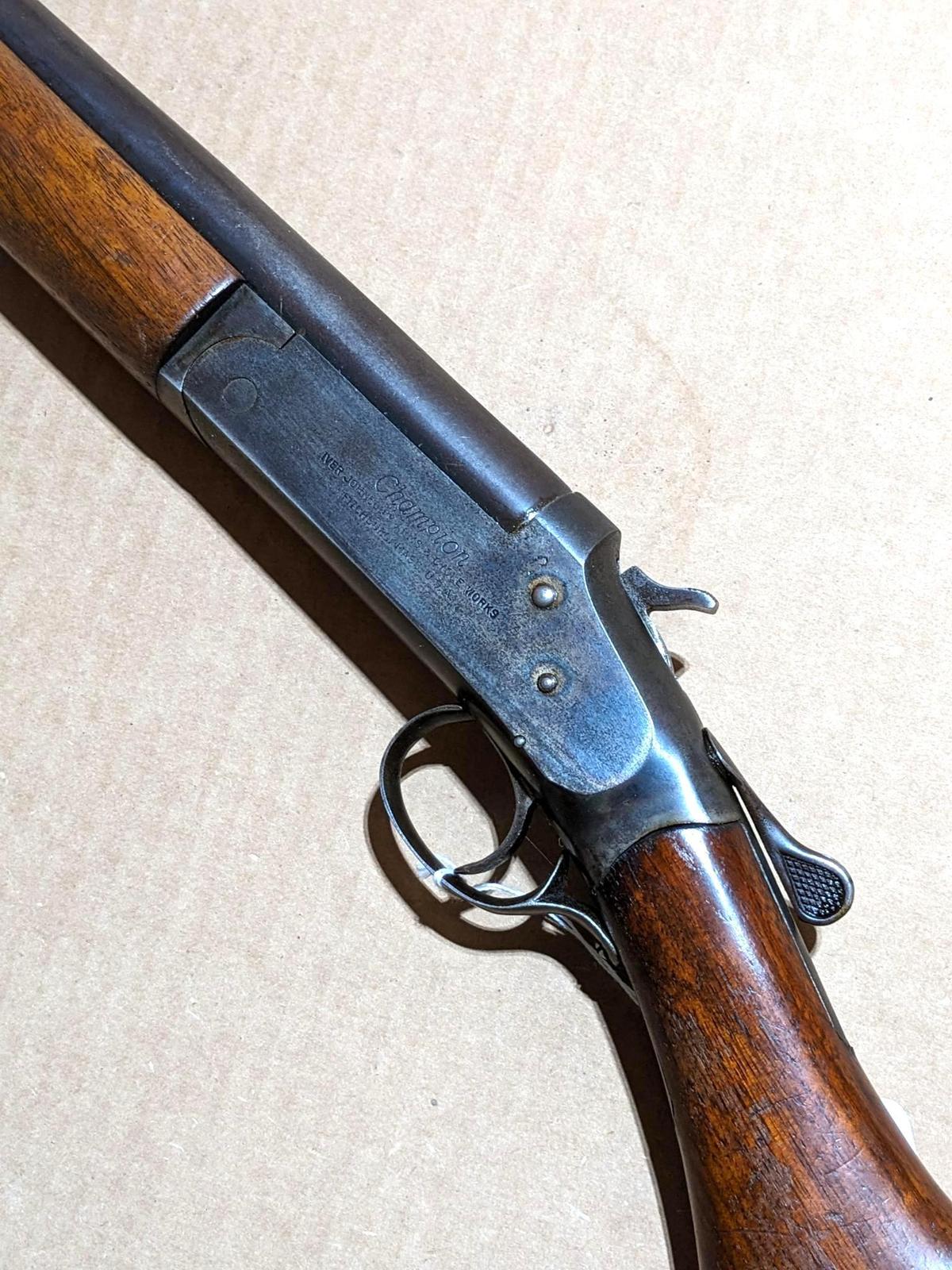 Iver Johnson Champion top break 12 gauge shotgun. The 30" barrel has a bright bore. Bluing is mostly