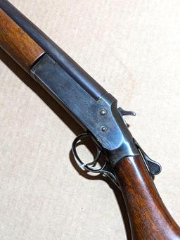 Iver Johnson Champion top break 12 gauge shotgun. The 30" barrel has a bright bore. Bluing is mostly