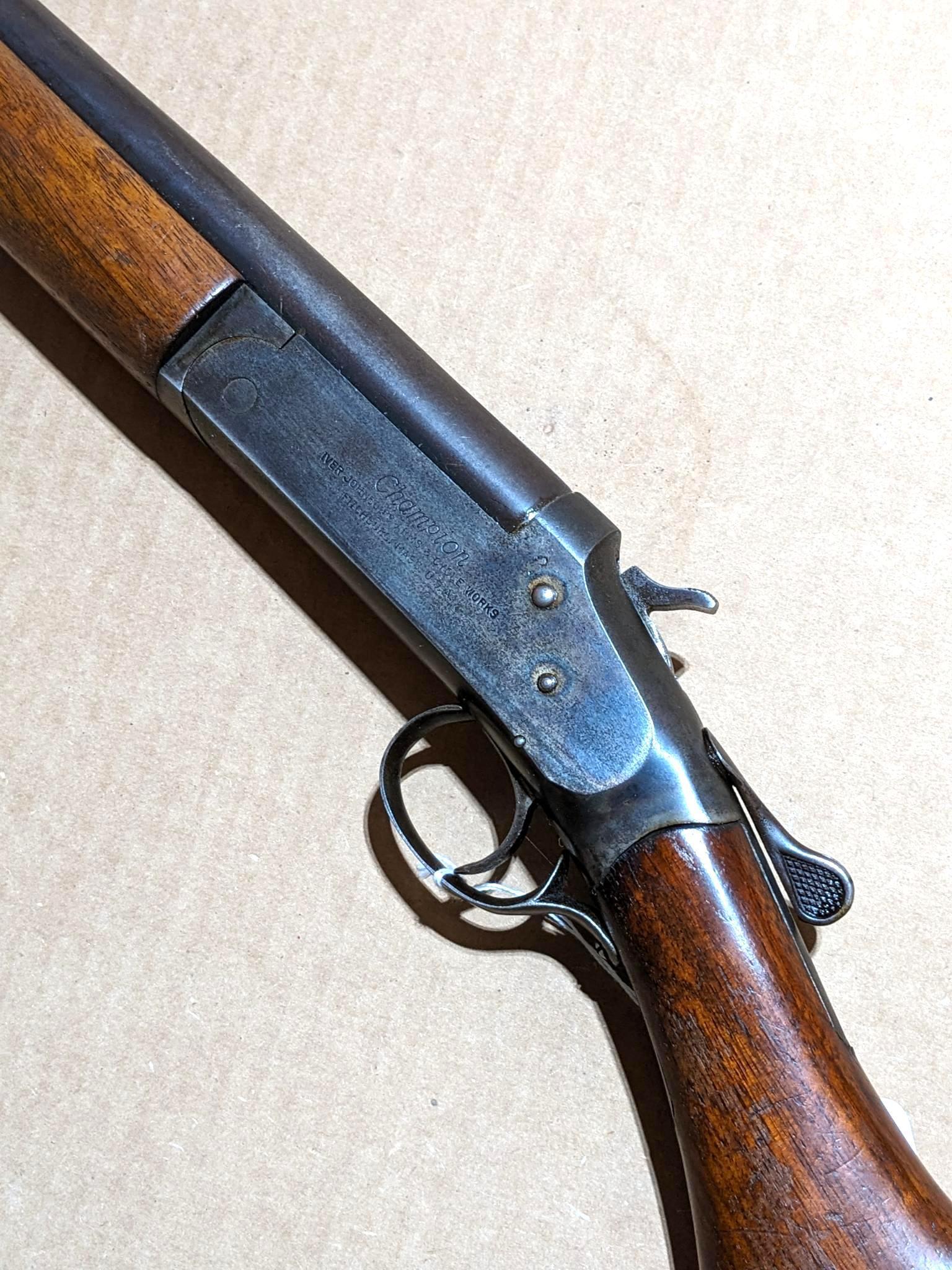 Iver Johnson Champion top break 12 gauge shotgun. The 30" barrel has a bright bore. Bluing is mostly