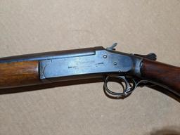 Iver Johnson Champion top break 12 gauge shotgun. The 30" barrel has a bright bore. Bluing is mostly