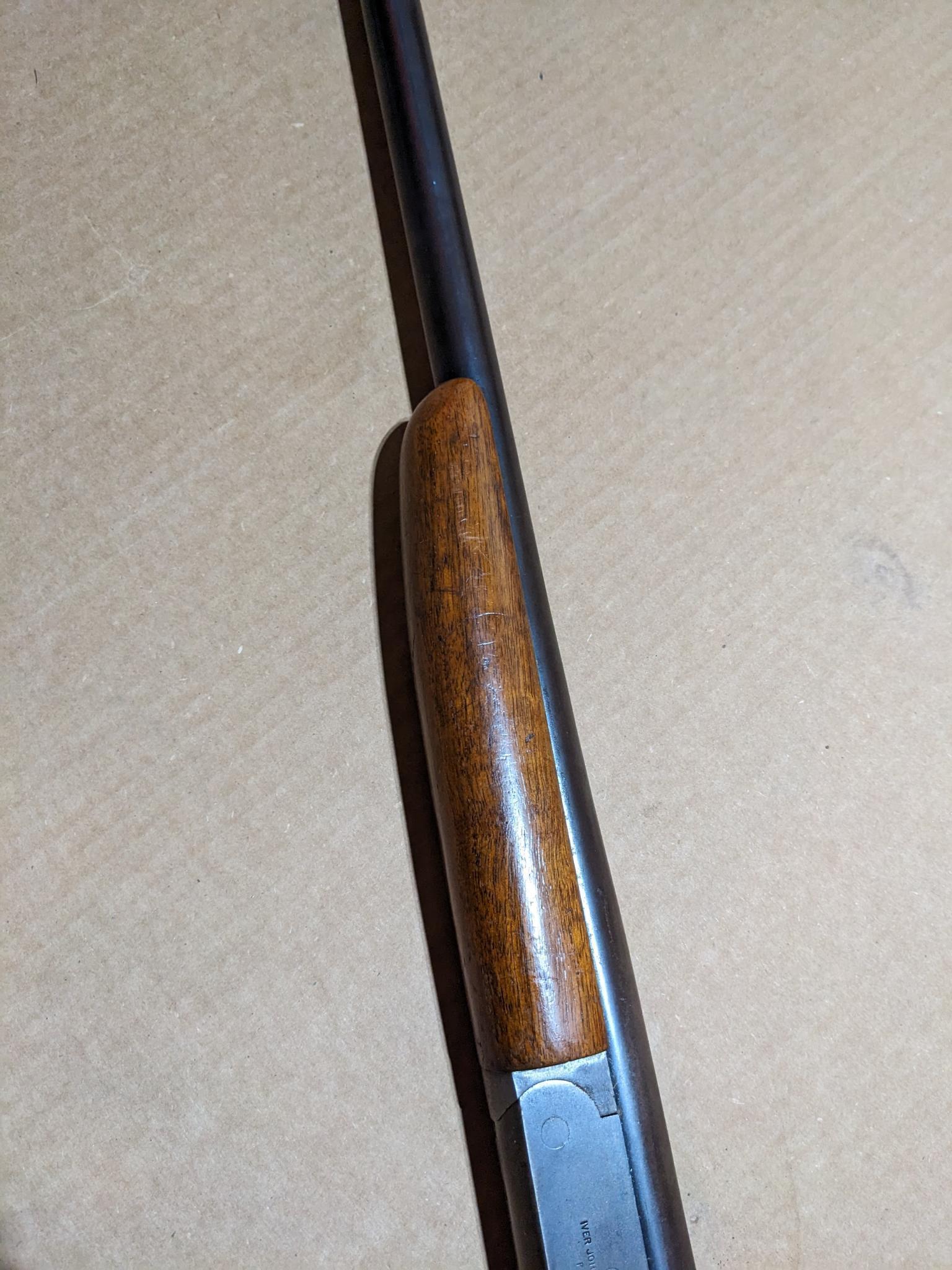 Iver Johnson Champion top break 12 gauge shotgun. The 30" barrel has a bright bore. Bluing is mostly