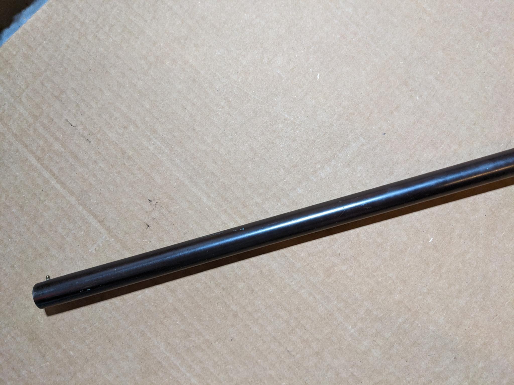 Iver Johnson Champion top break 12 gauge shotgun. The 30" barrel has a bright bore. Bluing is mostly