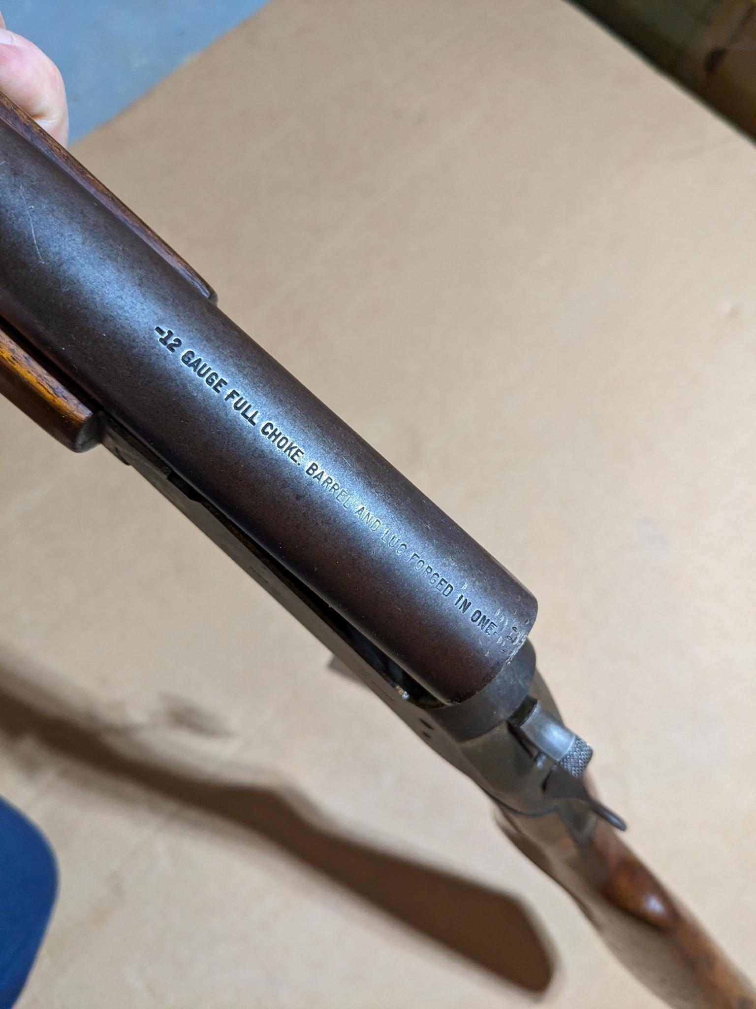 Iver Johnson Champion top break 12 gauge shotgun. The 30" barrel has a bright bore. Bluing is mostly