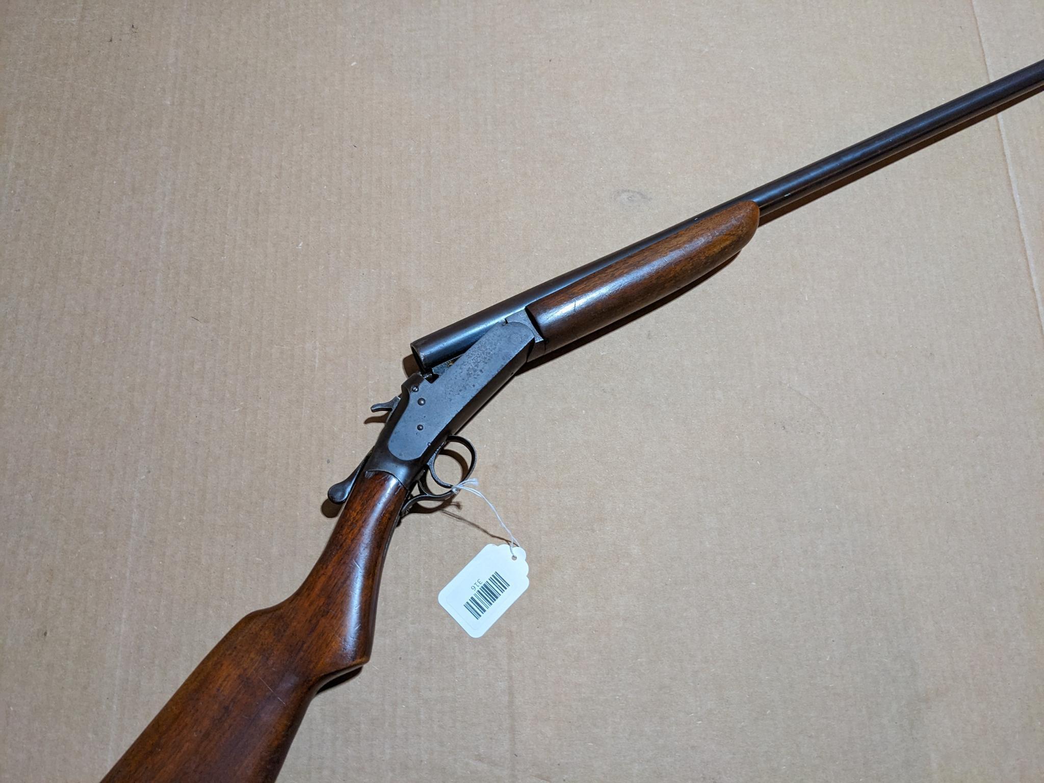 Iver Johnson Champion top break 12 gauge shotgun. The 30" barrel has a bright bore. Bluing is mostly