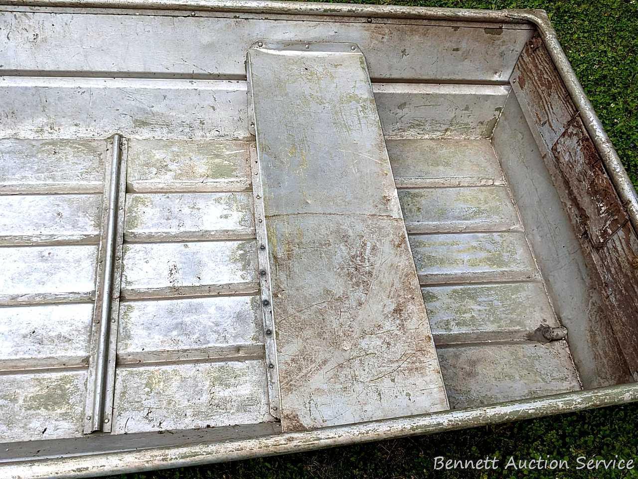 10' aluminum jon boat is in good condition with some silicone repairs.