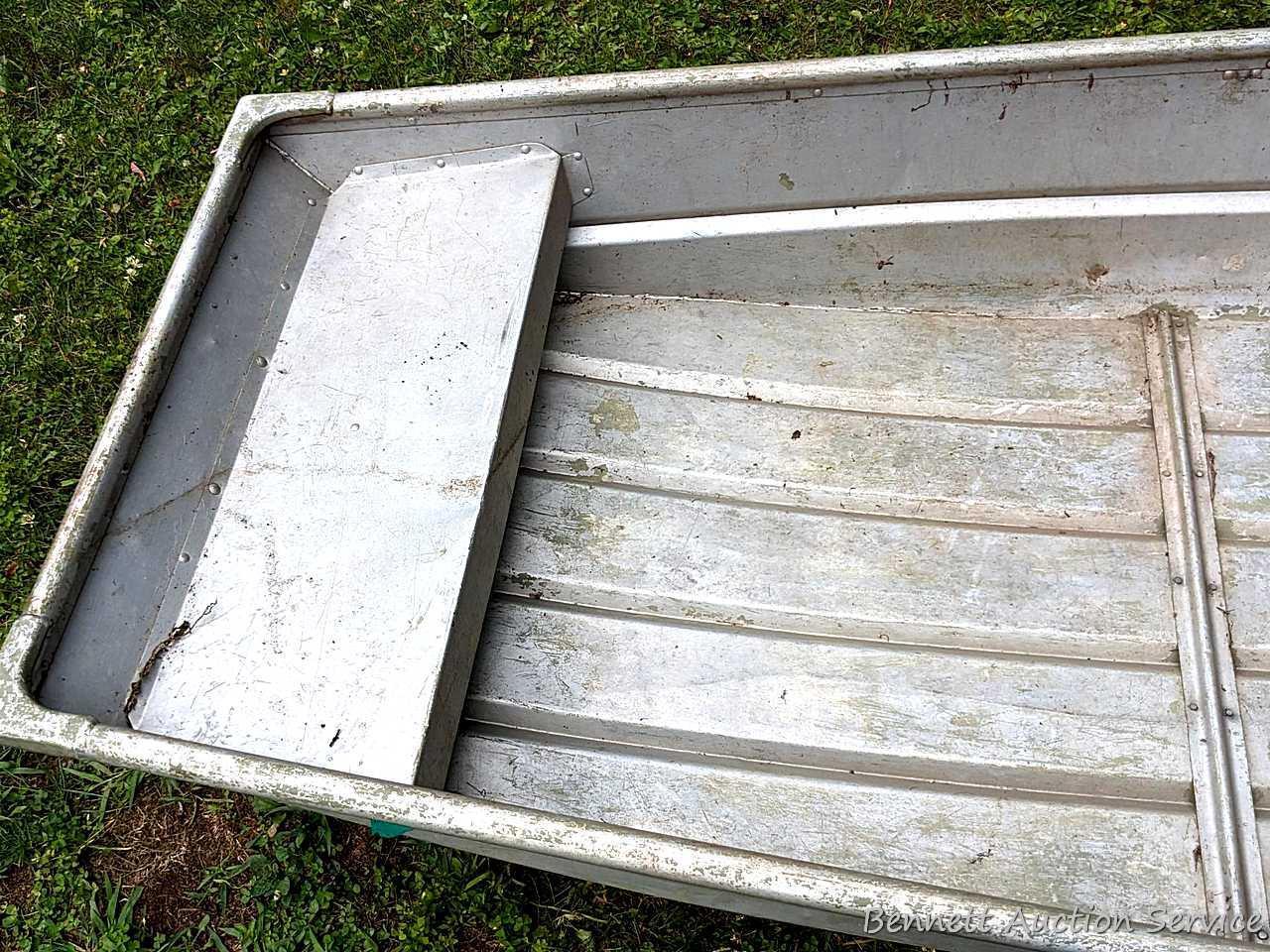 10' aluminum jon boat is in good condition with some silicone repairs.