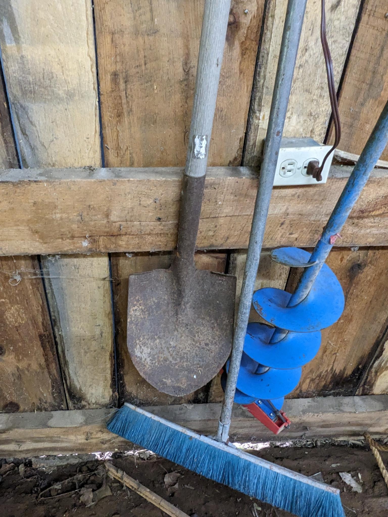 2' wide push broom and metal snow shovel, plus an ice auger and spade shovel.