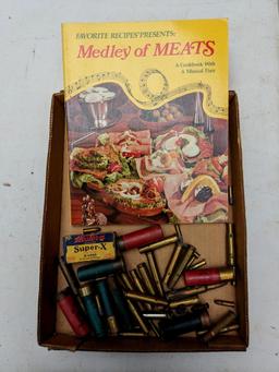 Meat cook book, plus ammunition including .22 long, 16 gauge, 12 gauge, .410 shot shells, .22LR,