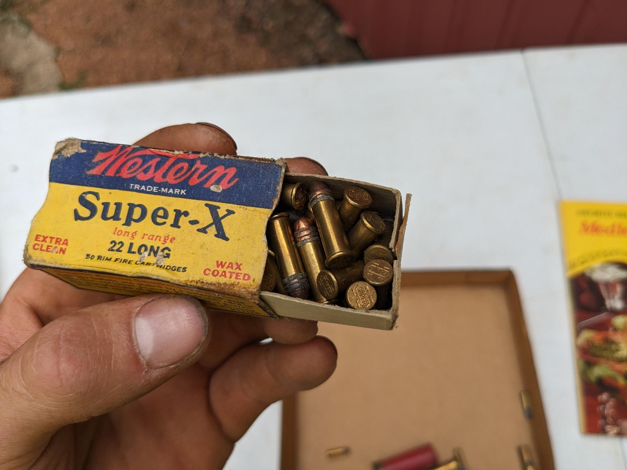 Meat cook book, plus ammunition including .22 long, 16 gauge, 12 gauge, .410 shot shells, .22LR,
