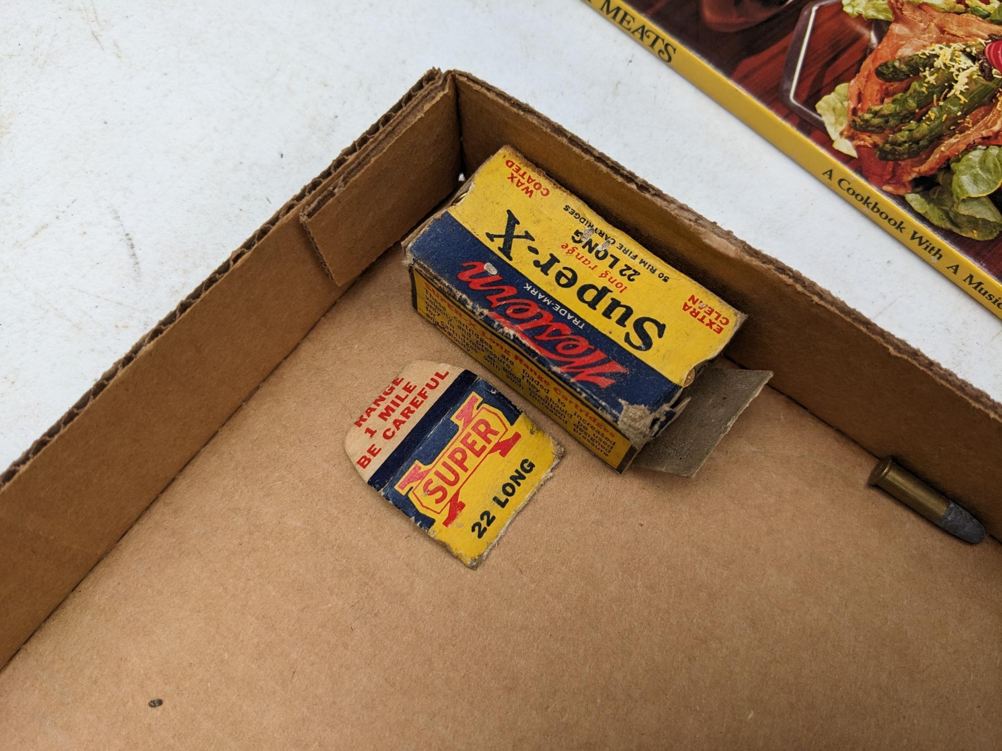 Meat cook book, plus ammunition including .22 long, 16 gauge, 12 gauge, .410 shot shells, .22LR,