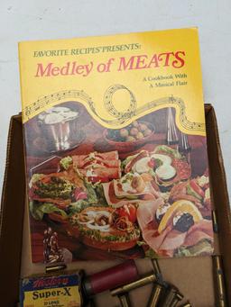Meat cook book, plus ammunition including .22 long, 16 gauge, 12 gauge, .410 shot shells, .22LR,