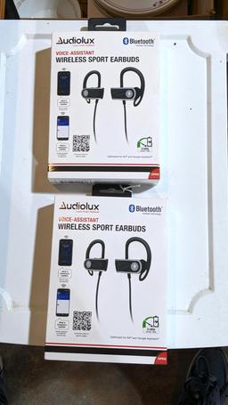 Two AudioLux wireless sport earbuds with voice assistant. Appear unused.