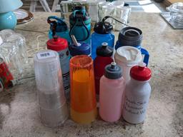 Assorted water bottles and cups as pictured.