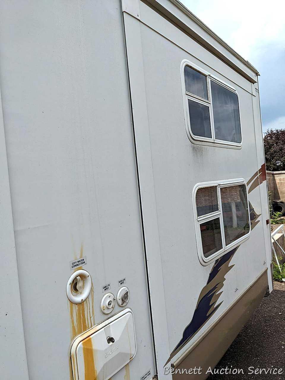 Jayco Eagle 314 BHDS slide-out camper has three beds, bathroom with shower...