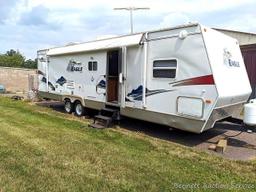 Jayco Eagle 314 BHDS slide-out camper has three beds, bathroom with shower...