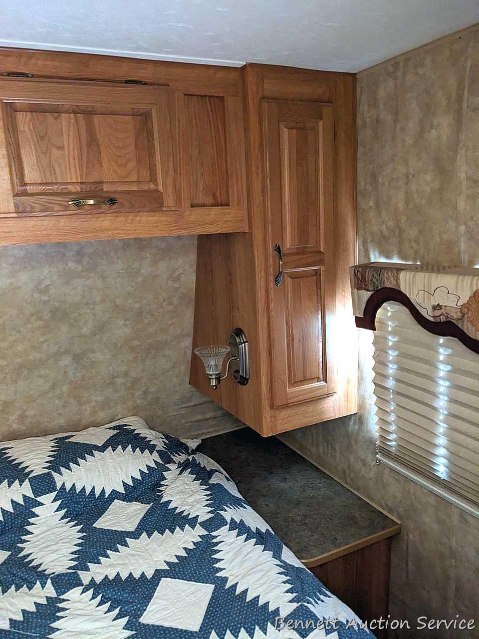 Jayco Eagle 314 BHDS slide-out camper has three beds, bathroom with shower...