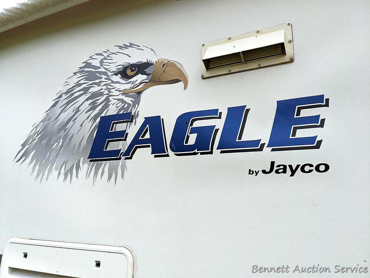 Jayco Eagle 314 BHDS slide-out camper has three beds, bathroom with shower...