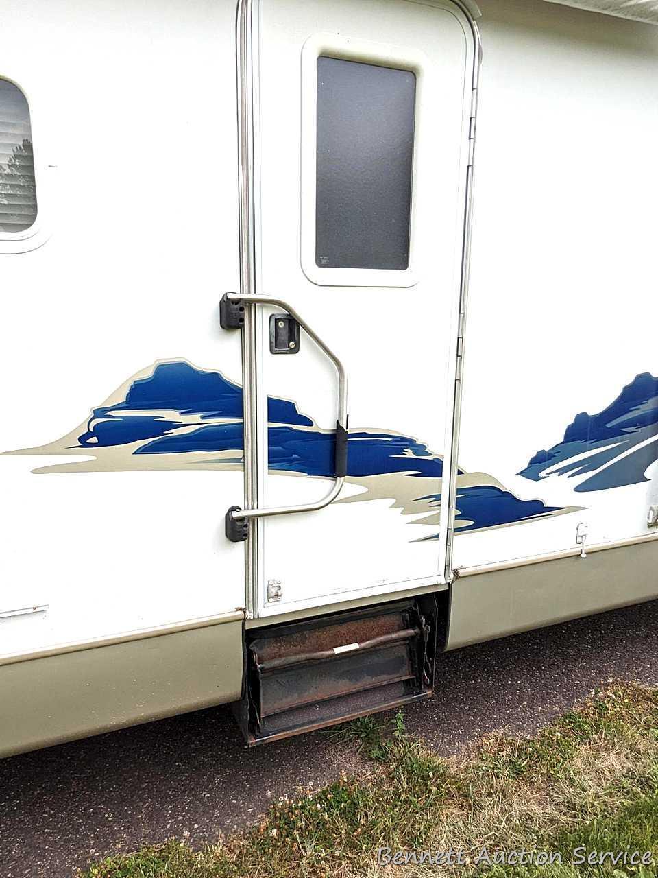 Jayco Eagle 314 BHDS slide-out camper has three beds, bathroom with shower...