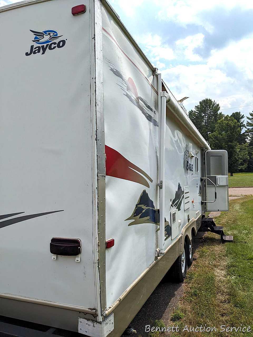 Jayco Eagle 314 BHDS slide-out camper has three beds, bathroom with shower...