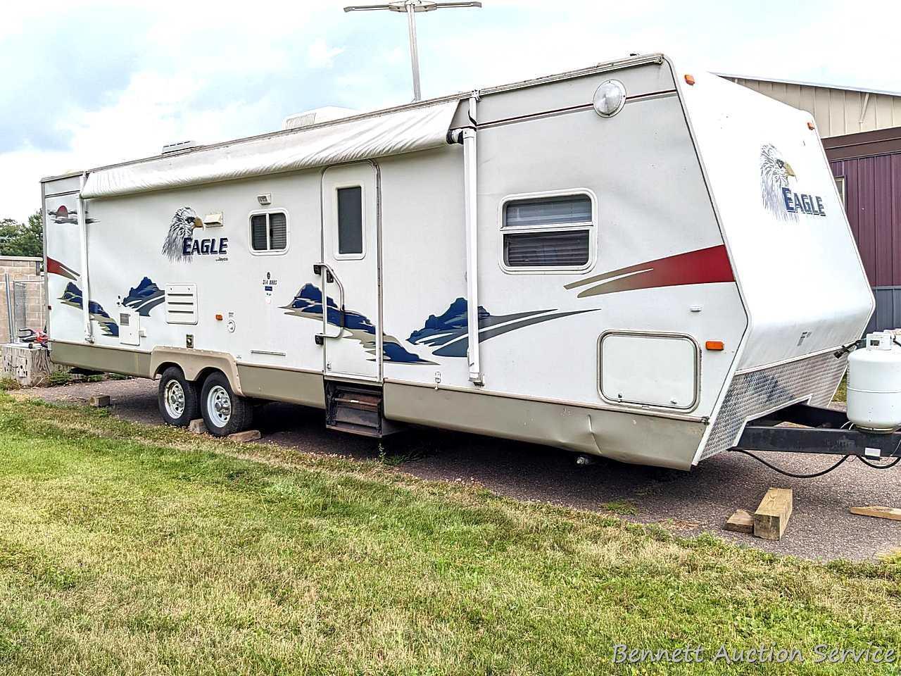 Jayco Eagle 314 BHDS slide-out camper has three beds, bathroom with shower...