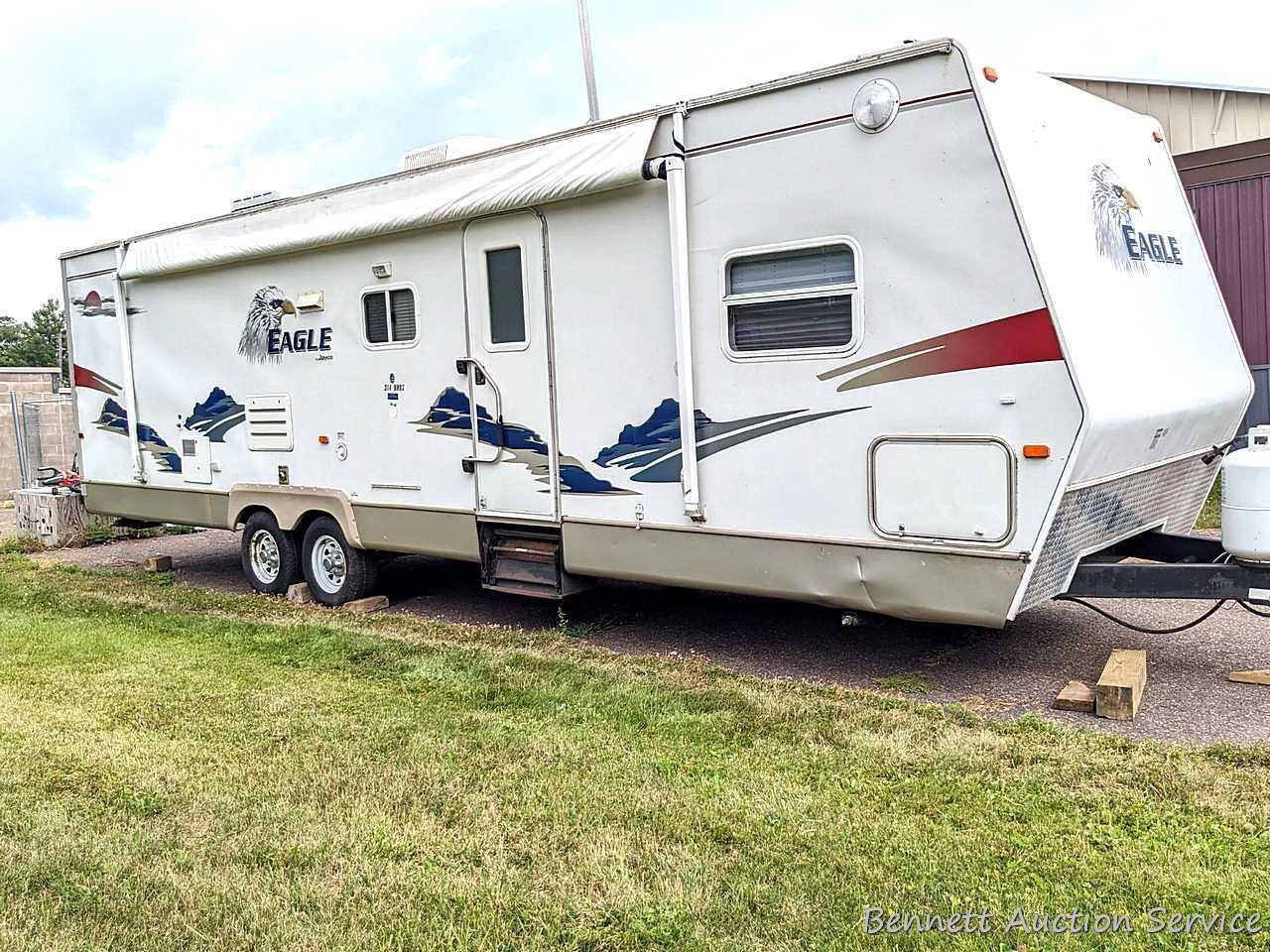 Jayco Eagle 314 BHDS slide-out camper has three beds, bathroom with shower...