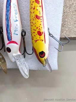 Seven fishing lures are about 7" long and great for musky and other game fish.