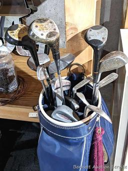 Golf clubs incl Wilson and other in a 34" golf bag with contents incl balls and more. Tallest in bag