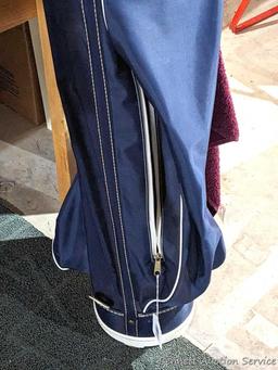 Golf clubs incl Wilson and other in a 34" golf bag with contents incl balls and more. Tallest in bag