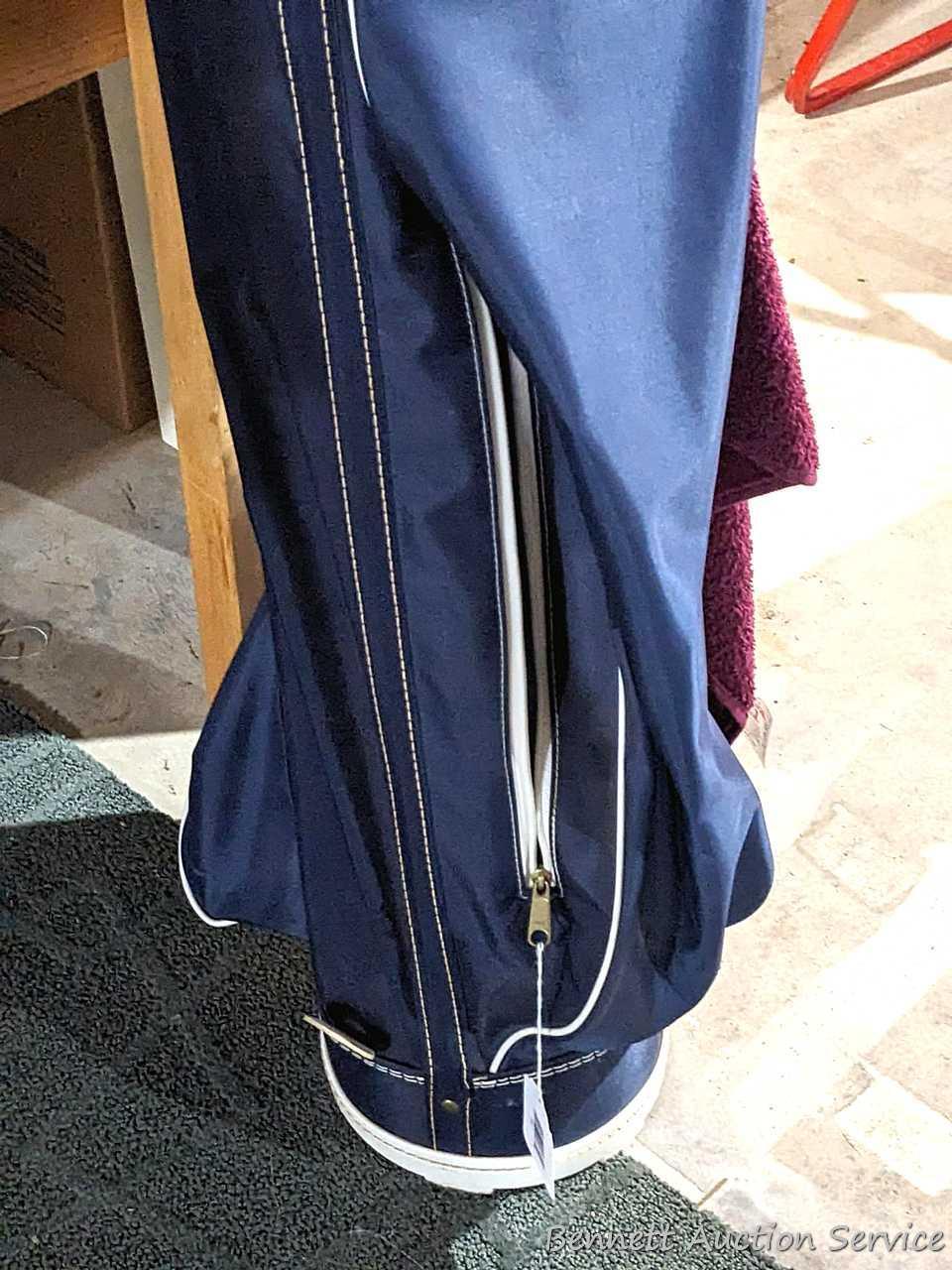 Golf clubs incl Wilson and other in a 34" golf bag with contents incl balls and more. Tallest in bag