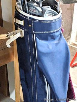 Golf clubs incl Wilson and other in a 34" golf bag with contents incl balls and more. Tallest in bag