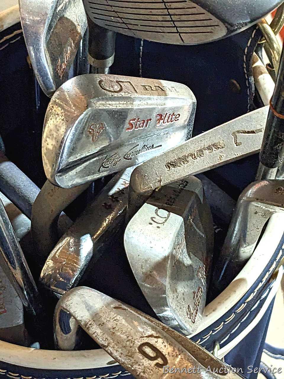 Golf clubs incl Wilson and other in a 34" golf bag with contents incl balls and more. Tallest in bag