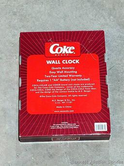 Nice Coca-Cola folding chair about 23" over wooden arms, plus a clock and phone that look new.