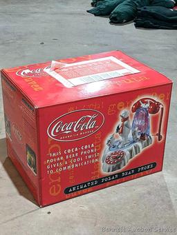 Nice Coca-Cola folding chair about 23" over wooden arms, plus a clock and phone that look new.