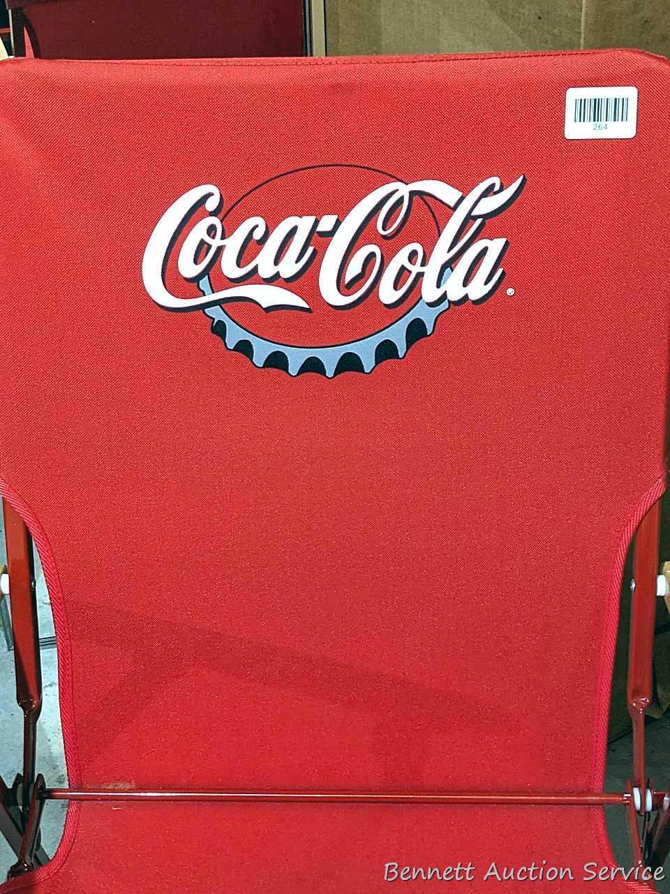Nice Coca-Cola folding chair about 23" over wooden arms, plus a clock and phone that look new.