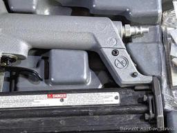 Senco pneumatic nailer with case and manual.