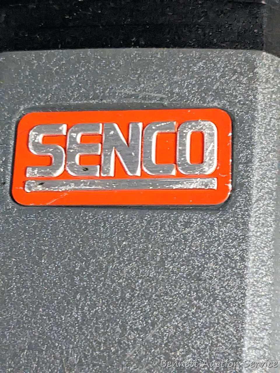 Senco pneumatic nailer with case and manual.