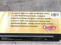 300 watt halogen shop light is new in box - great for garage or workshop.