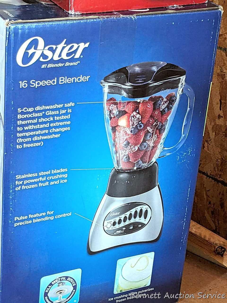 Oster 16 speed blender looks to be NIB, Air Crazy popcorn popper, and a pair of ice cube trays.